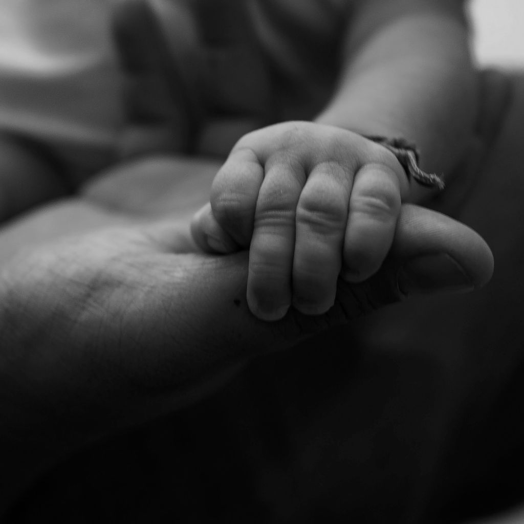 A child holding his father